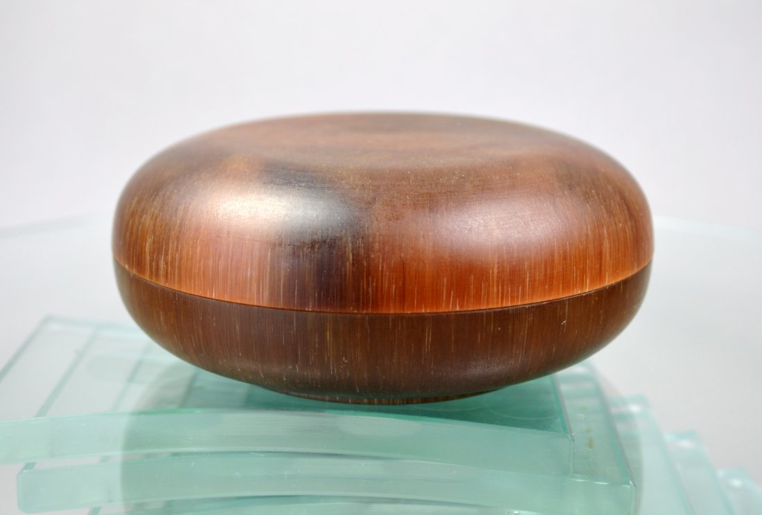 CHINESE CARVED VINTAGE RHINOCEROS HORN LIDDED PASTE JAR: A vintage Chinese carved Rhinoceros horn lidded paste jar with superb hazelnut color variation. Diameter 3.75 by height 1.5 inches. Weight: 251 grams. Excellent condition. Provenance: Private collecti
