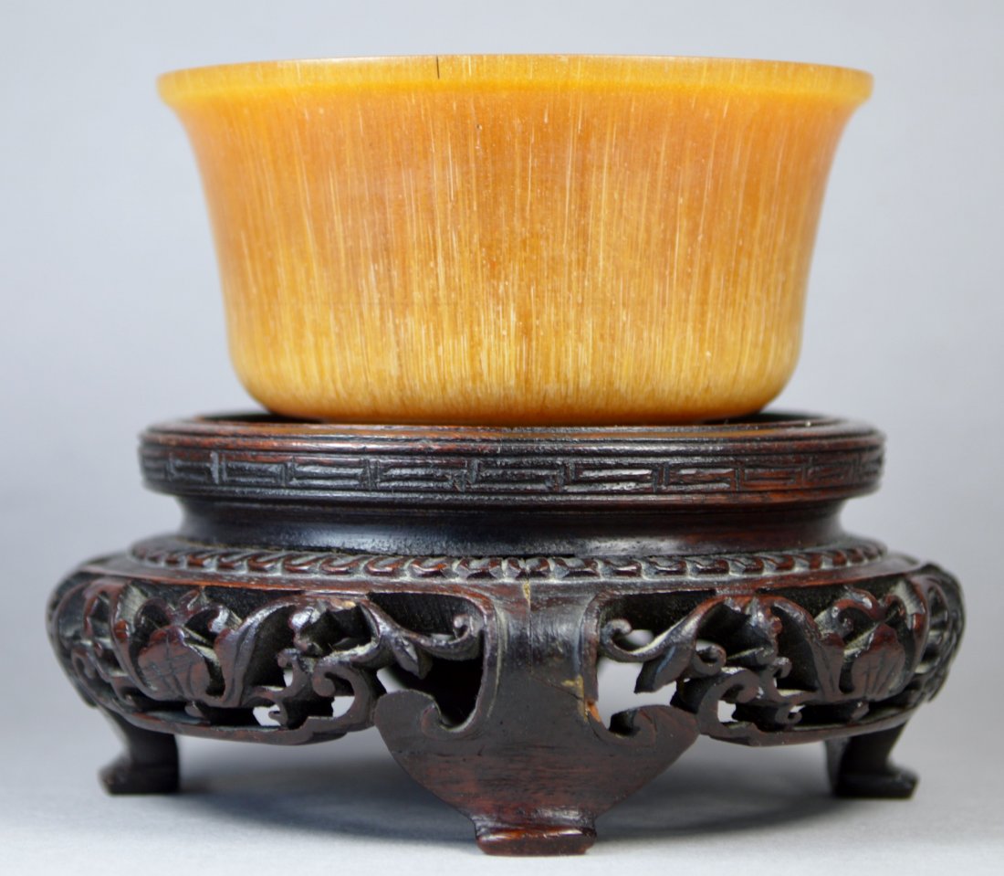 A RARE SUPERB CHINESE VINTAGE RHINOCEROS CARVED CUP: A rare vintage Chinese Rhinoceros horn cup. Featuring a beautiful light honey coloration throughout, great carving quality, with slightly flared rim, a total weight of 124 gr, rim diameter: 80 mm, and
