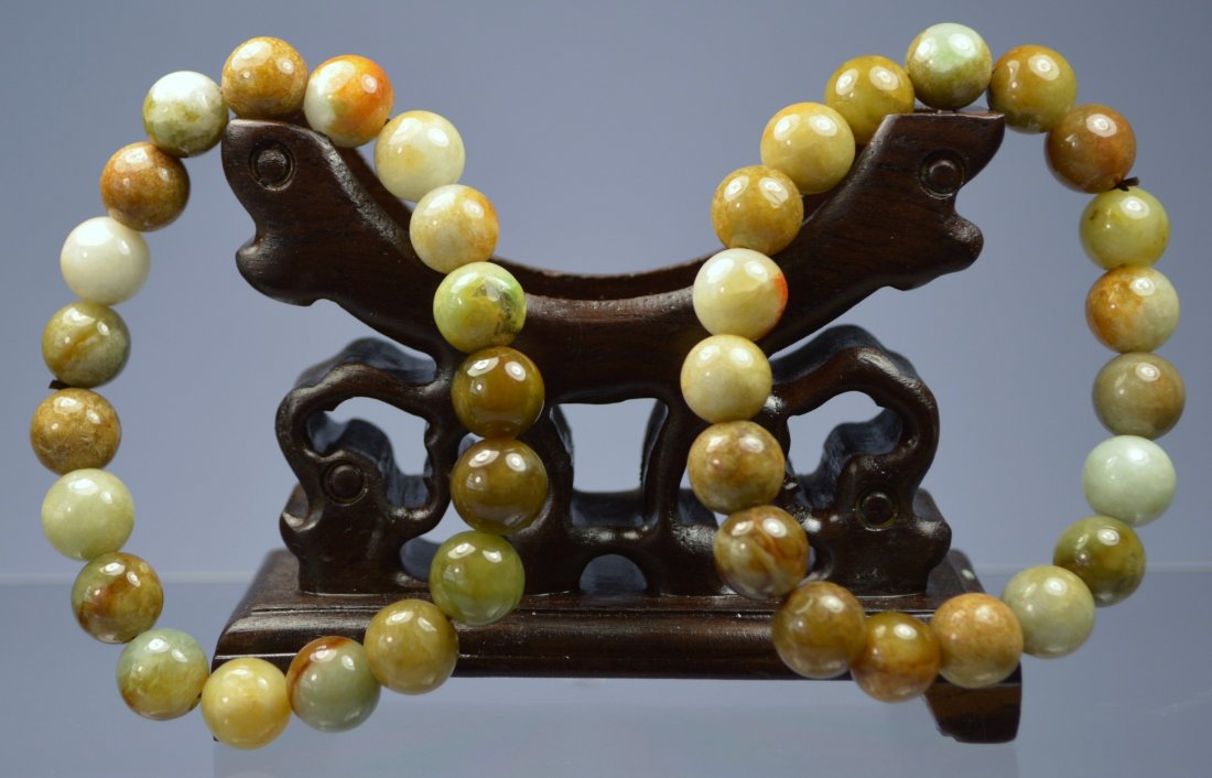 CHINESE SUPERB HE-TIAN JADE CARVED BEAD BRACELETS (PAIR: Each bead is 9 mm, 19 beads on each, excellent condition. Appear to be grade A. Provenance: Private collector, South Florida.