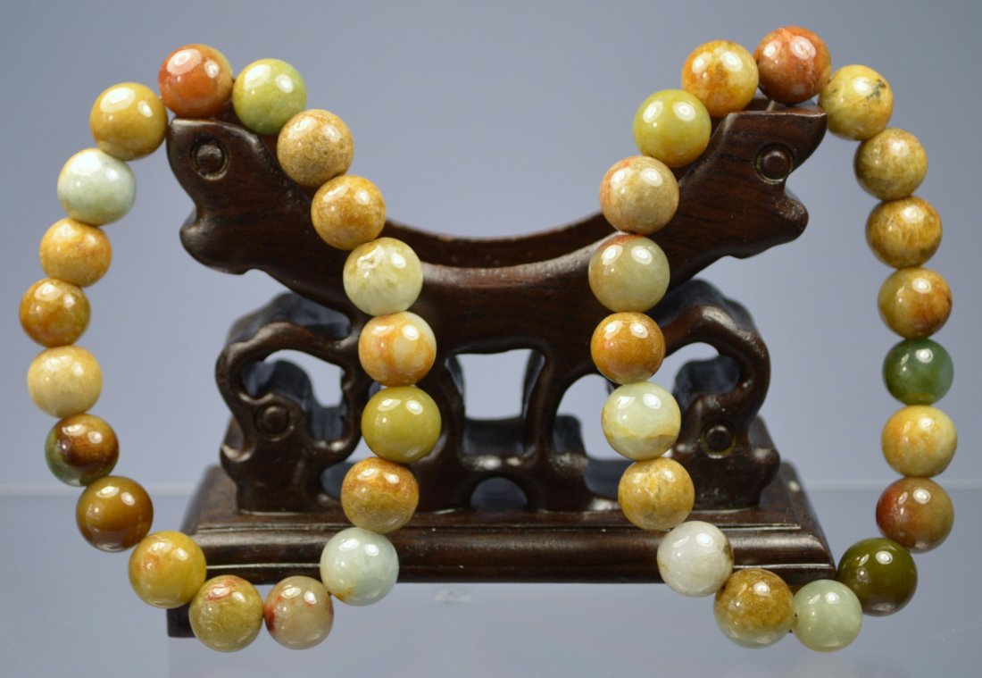 CHINESE SUPERB HE-TIAN JADE CARVED BEAD BRACELETS (PAIR: Each bead is 9 mm, 19 beads on each, excellent condition. Appear to be grade A. Provenance: Private collector, South Florida.