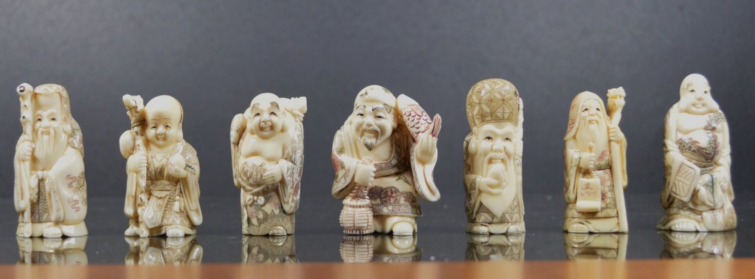 A RARE JAPANESE ANTIQUE IVORY NETSUKE GROUPING ( 7 EA): A rare and stunning antique ivory carved netsuke grouping of seven gods, in excellent condition. This museum quality grouping is extremely finely carved, an smooth signed at the bottom, average size i