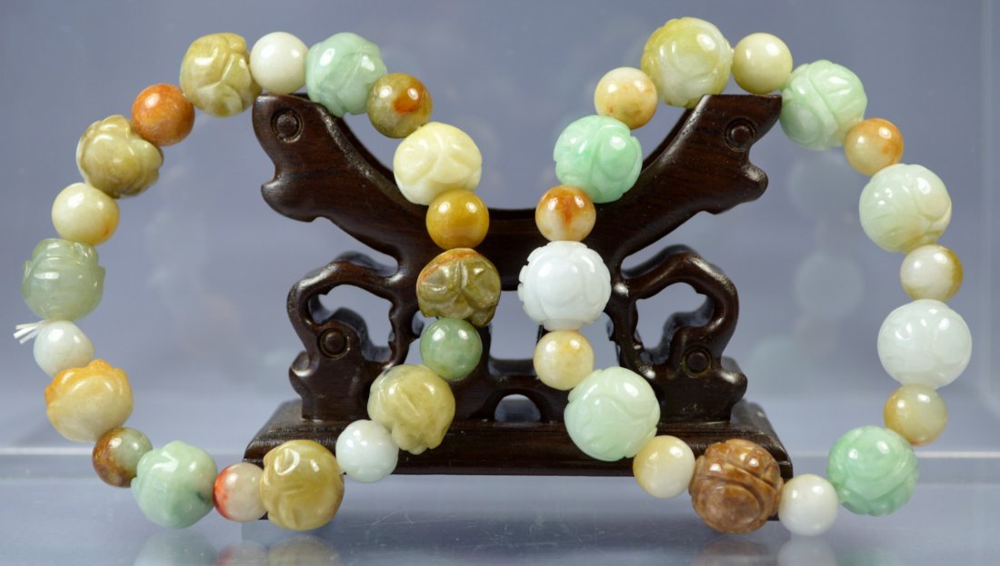 CHINESE PAIR OF NATURAL CARVED JADE BEAD BRACELETS (PR): A superbly carved natural jade bead bracelets (pr). Largest bead is 15 mm. Exellent condition. Provenance: Private collection, Chicago.