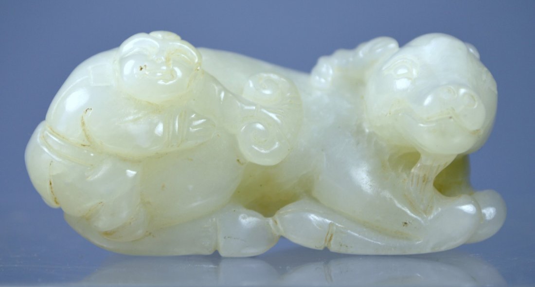 CHINESE ANTIQUE TOP MUTTON FAT CARVED JADE STATUE: An amazing Chinese top quality antique carved jade statue. A superbly carved mutton fat jade depicting water buffalo and a boy with ruyi with fine polish. Size: 66 x 36 x 26 mm. Excellent condition. P