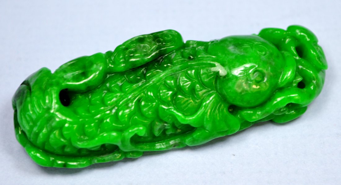 CHINESE TOP CERTIFIED CARVED JADE PENDANT/AMULET: An amazing top quality certified apple green jade pendant amulet. Carved as a mythical fish figure, it has superb deep color and polish. Certified by PNJ Labs (equivalent of GIA in Asia). Size 62 x 21