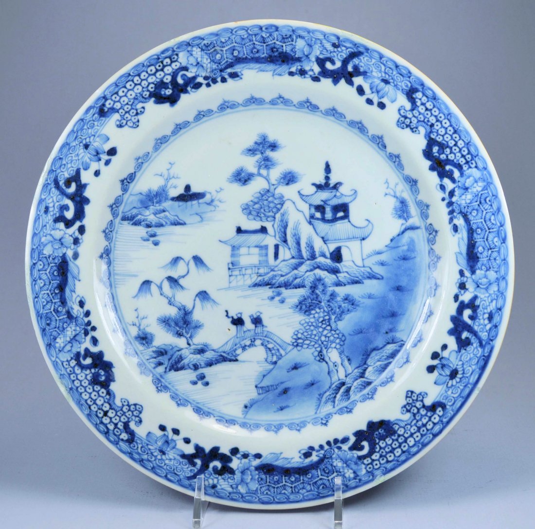 CHINESE QIANLONG PORC PLATE CA. 18TH C: A stunning Chinese blue on white Qianlong porcelain plate ca 18th C. Depicts a romantic landscape scene with soft glaze. Diameter: 23 cm. Very good condition, one minor rim touch up short tight hairli