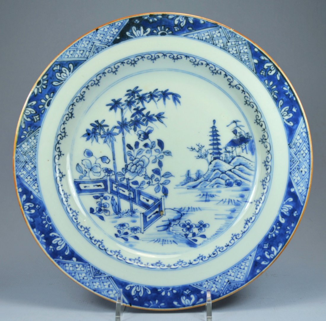 CHINESE QIANLONG PORC PLATE CA. 18TH C: A stunning Chinese blue on white Qianlong porcelain plate ca 18th C. Depicts a romantic landscape scene with soft glaze. Diameter: 22.5 cm. Excellent condition apart from one minor iron burn at lower 