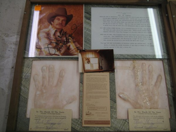 Merle Haggard Framed Hand Prints with autograph V: Merle Haggard Framed Hand Prints with 2 autographed certificates, autographed picture & Flyer All of the hand prints came from the estate of Ed Huffman who had a traveling museum called "Museum Americ