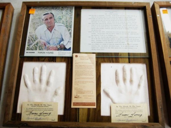 Faron Young Framed Hand Prints with autograph Ver: Faron Young Framed Hand Prints with 2 autographed certificates, a photo and flyer All of the hand prints came from the estate of Ed Huffman who had a traveling museum called "Museum Americana" in whic