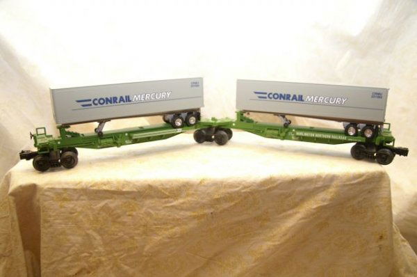 6-52041: Lionel lots conv. Car conrail mercury service trailers on BW flat cars