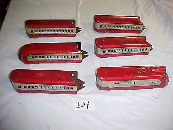 Marx M-10000 Train: Marx M-10000 TrainIncludes engine, 5 cars. Engine doesn't have a motor.Fair cond., with scratches, dents, and rust.