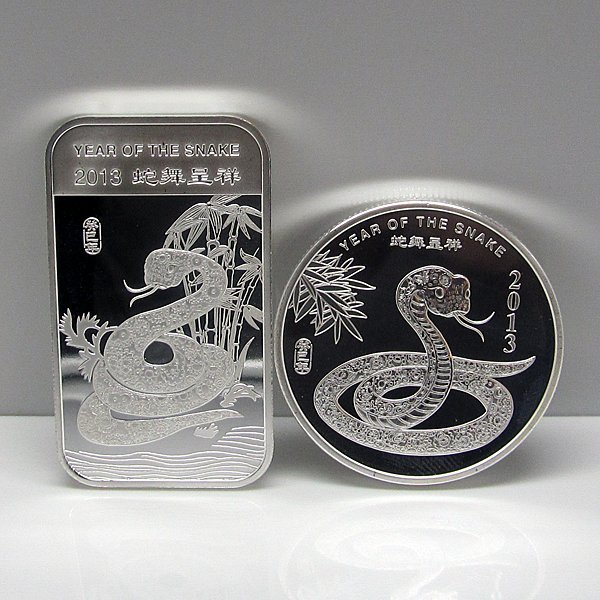 2013 Year of the Snake .999 Fine Silver Bar & Round: Bar & Round Set Includes: 2013 1 Oz Year of the Snake .999 Fine Silver Bar & 2013 1 Oz Year of the Snake .999 Fine Silver Round. Made in USA.