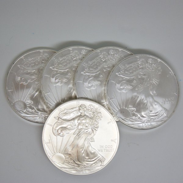 5-Coin Set American Silver Eagles - Unc: 5-Coin Set Silver American Eagles by The United States Mint. Each Silver Eagle Coin Has a Legal Tender Value of $1 and Contains 1 Oz of .999 Fine Silver. Dates are Based on in Stock Inventory and are 