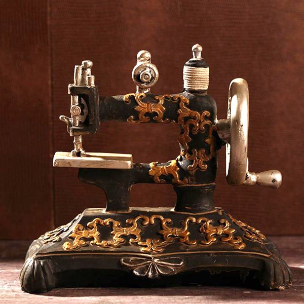 Miniature Vintage Sewing Machine 6.3": Miniature Vintage Sewing Machine - Resin - Dimensions: 6.3" L x 6" H x 4" D SHIPPING - Free shipping. - Most orders ship within 15-25 business days of purchase, but sometimes it takes up to 30-40 busi