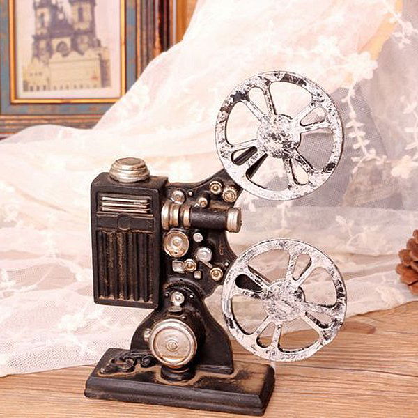 Miniature Vintage Film Projector 7.5": Miniature Vintage Film Projector - Resin - Dimensions: 7.5" H x 5.5" W x 1.65" D SHIPPING - Free shipping. - Most orders ship within 15-25 business days of purchase, but sometimes it takes up to 30-40