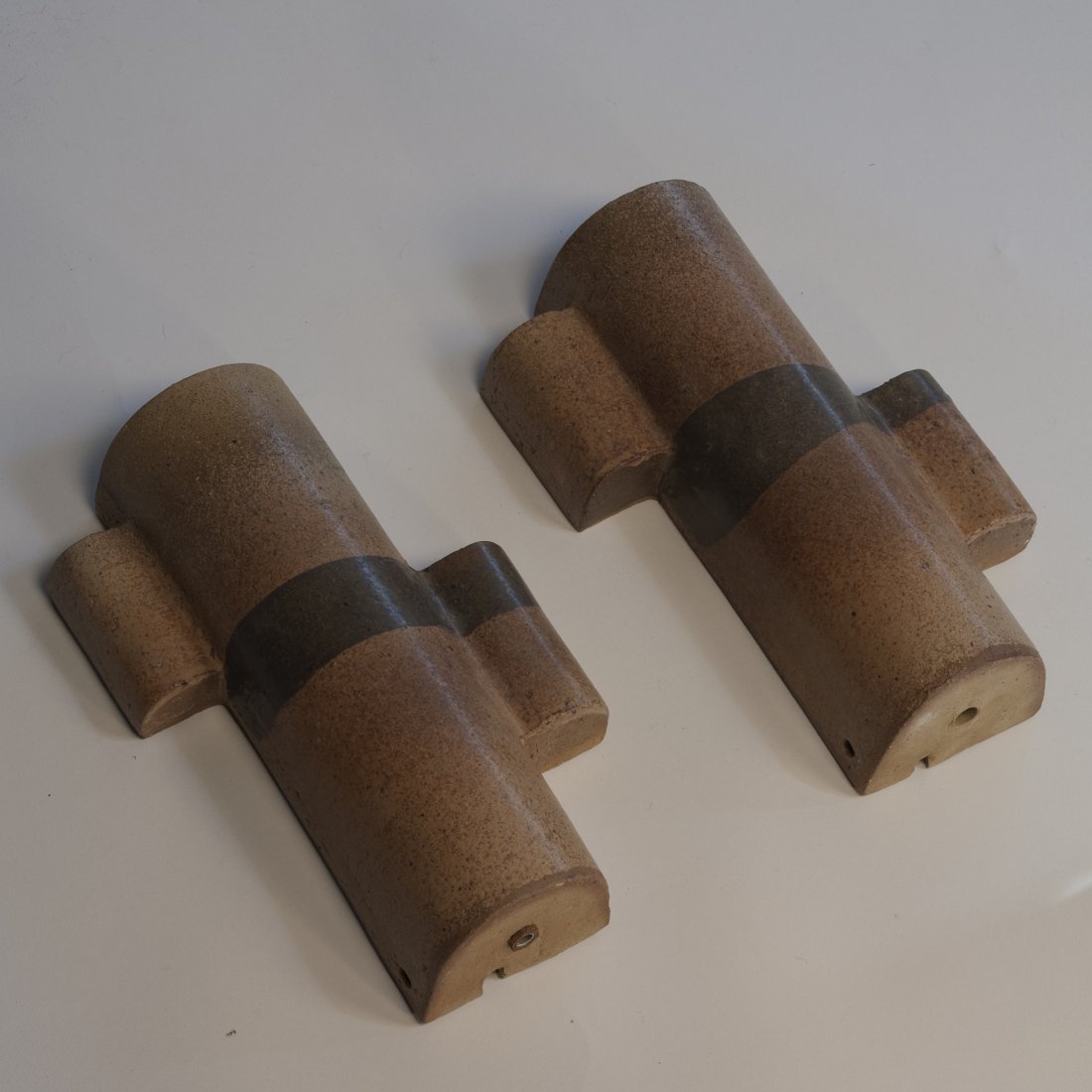 Ceramic Wall Sconces by Accolay, Pair.: Pair of ceramic wall sconces, of half cylindrical form, having offset flanges on either side, brown gradient glaze with black band, by Accolay, French 1950s. Signed to back. Height 12 1/2 in, width fr
