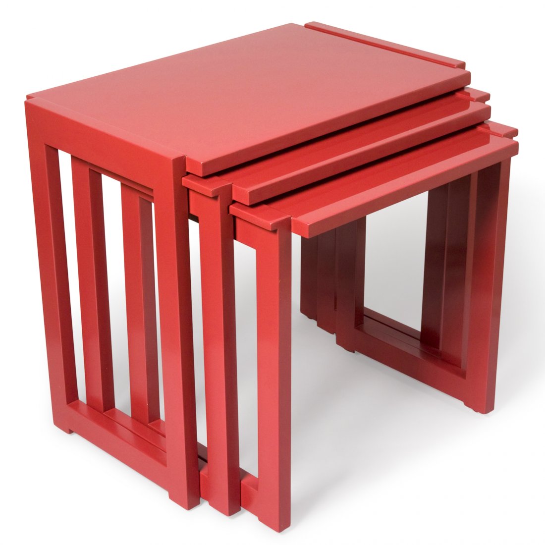 Paul Laszlo Nest of Tables: Set of three dark red lacquered end tables, with open rectangle side supports, by Paul Laszlo for Brown Saltman, American, 1950s. The largest measuring 24 x 16 in, height 22 1/4 in.