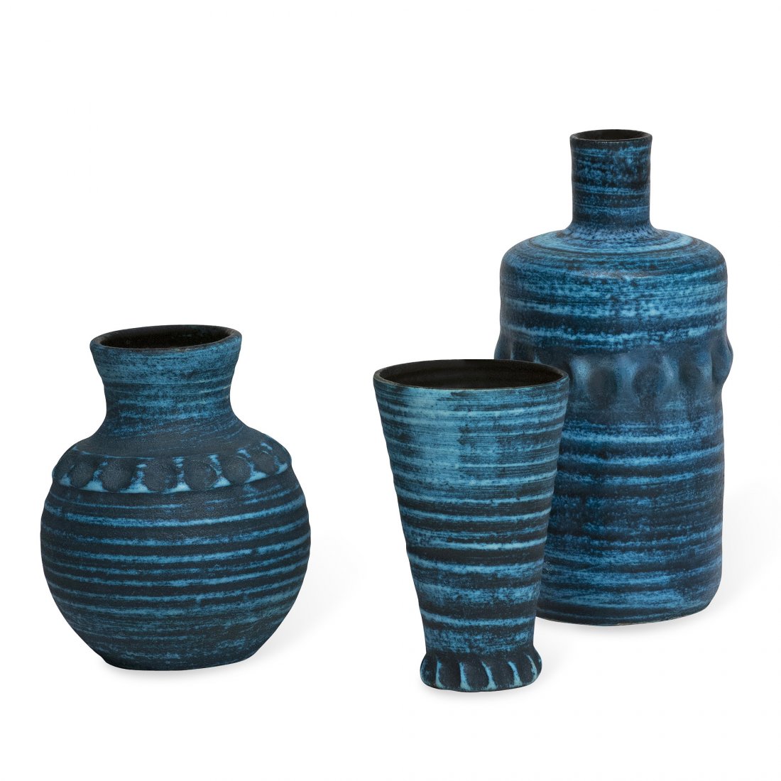 Three Accolay Ceramics: Set of three blue ceramic vases, dark blue glaze with thin light blue horizontal stripes, by Accolay, French 1950s. Signed to underside. In main photo: on left height 7 in, dia 5 1/2 in. center height