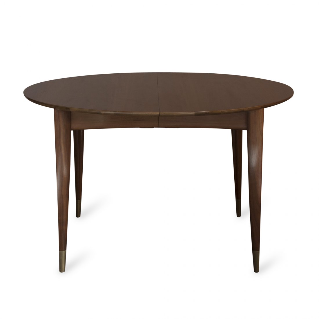 Gio Ponti for Singer, Four Leaves: Mahogany extension dining table with brass-capped feet and four 14" leaves. By Gio Ponti for Singer, Italian and American, 1950s. Seats 10-12. Closed: 29" x 48" diameter, overall length with four leav