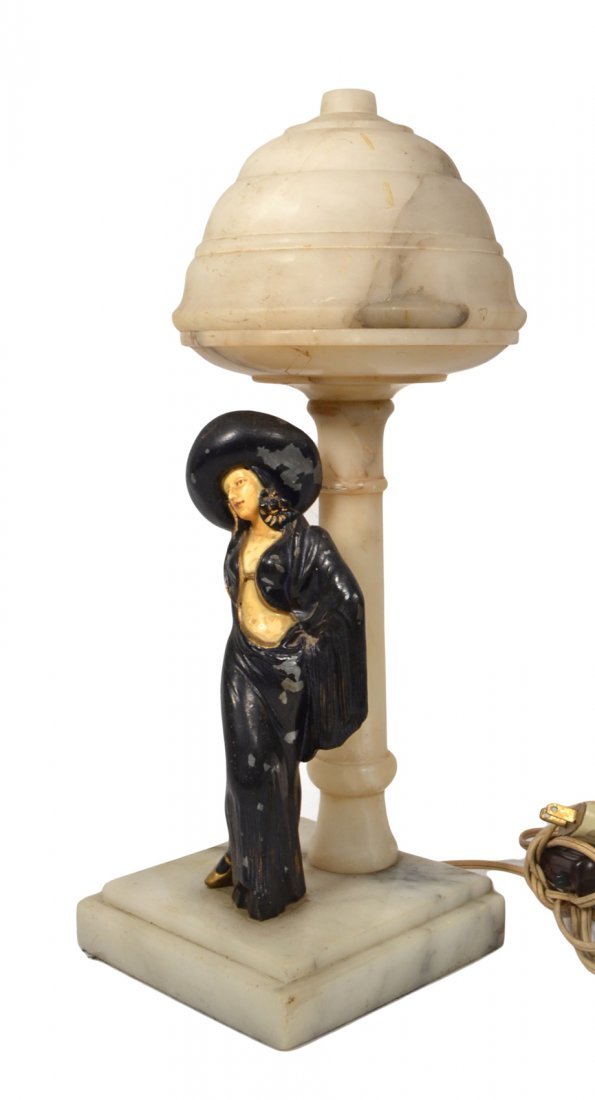 Art Deco Style Table Lamp: Art deco style marble lamp with a figure of a woman mounted on base. [16 1/2" H]. Alabaster shade bears partial crack. Paint loss. Wiring not tested.