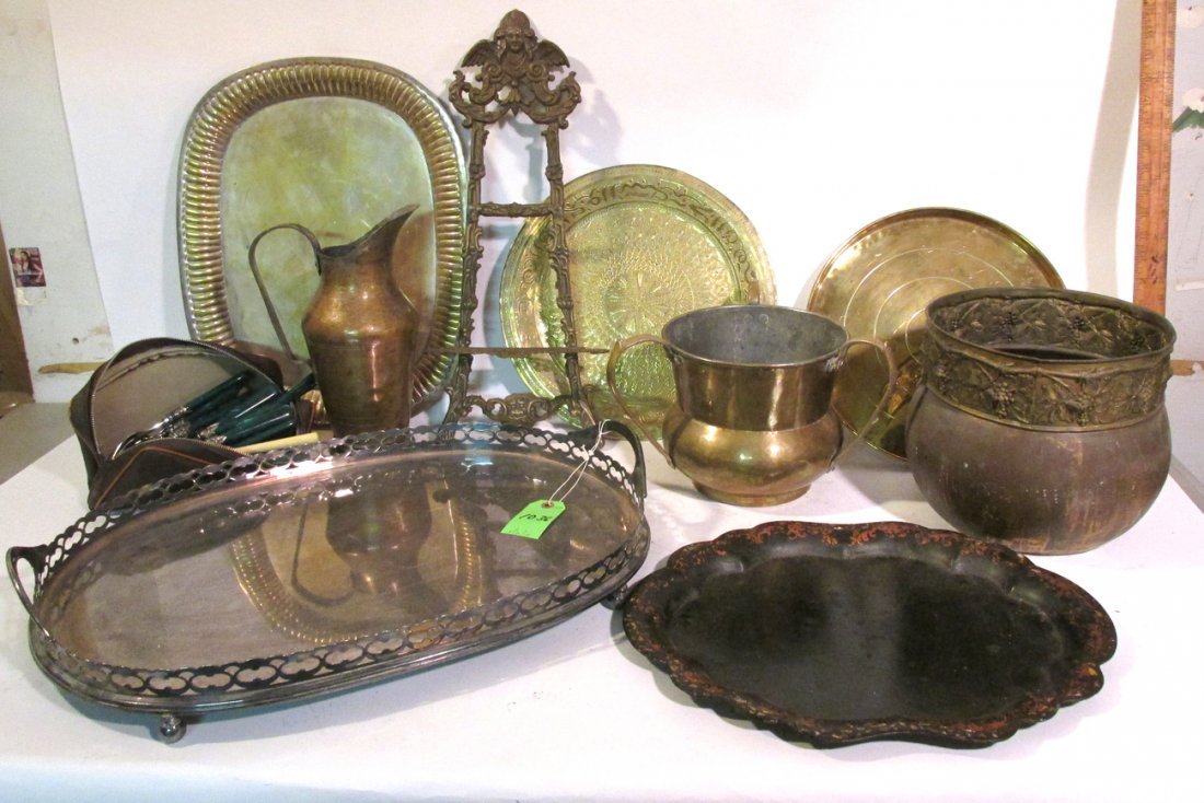 Lot of Brass, Bronze, Silver Plate Decor: Two silver plate trays, black tole tray, two brass water vessels, brass jardiniere, lot of flatware with sterling plate mountings, two trays, bronze easel. 11 pieces plus flatware.