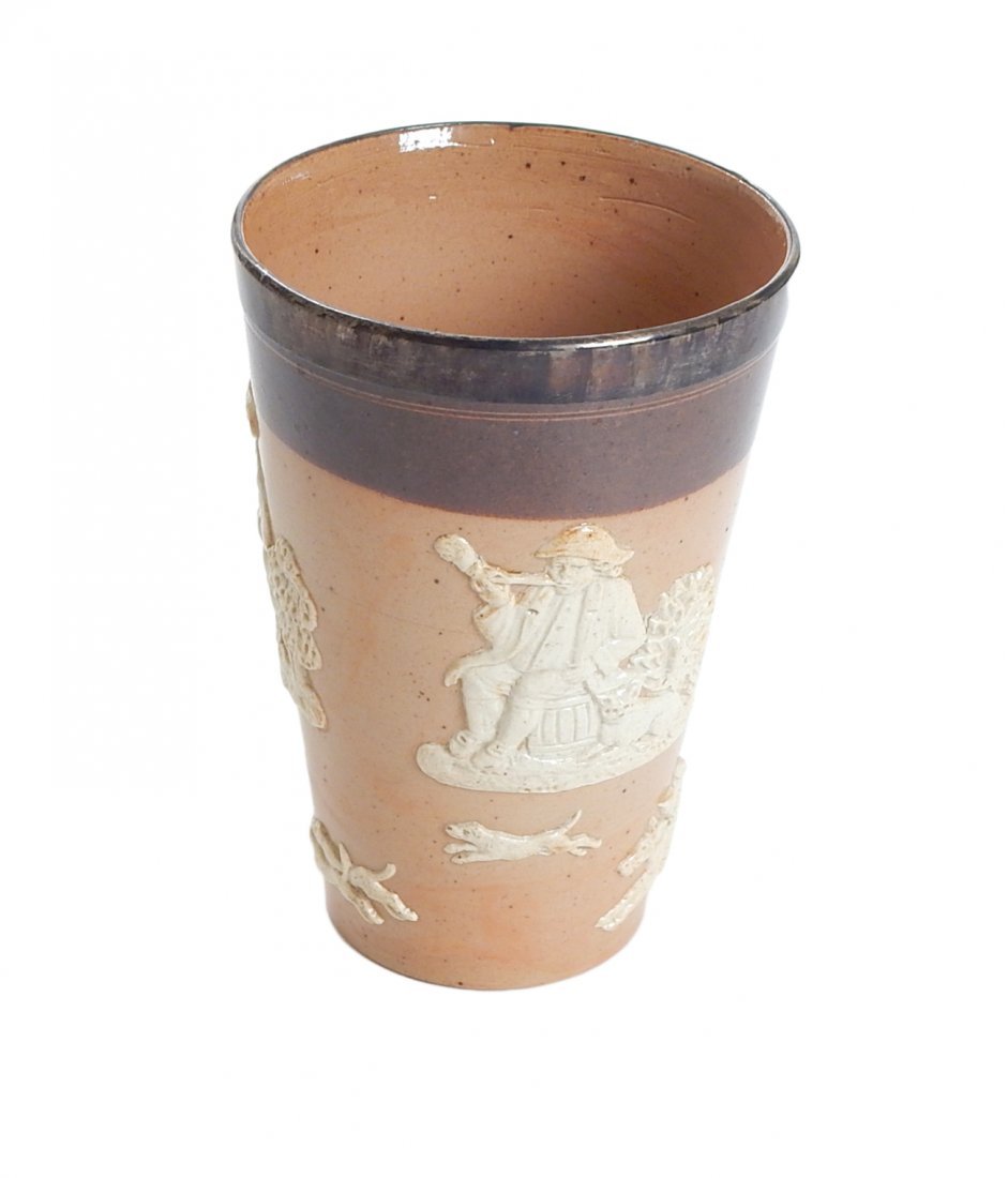 Doulton Stoneware Sterling Rimmed Cup: Royal Doulton sterling silver rimmed drinking cup. Marks on rim consist of sterling, London town mark and date letters representing the year 1893. Cup is also stamped on bottom "Doulton". 4 1/2" H x 3