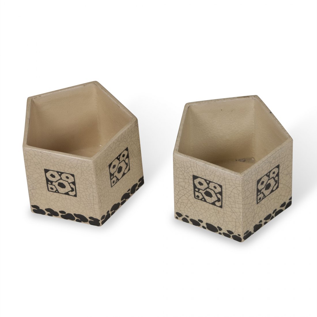 Jacques Adnet Ceramics: Pair of crackle glaze off-white pentagon shaped ceramic vases, with abstract flower decoration on sides and along bottom, by Jacques Adnet for Lusca, French circa 1925. Height 4 3/8 in. Distance acros