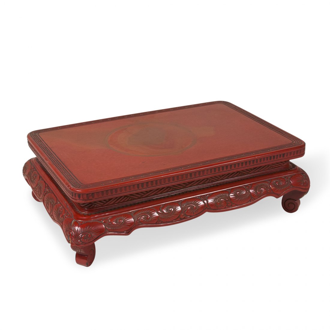 Chinese Tea Table: Deep red lacquered and carved wood tea table, Chinese style ornamentation, Chinese, 1970s. 20 1/4 in x 14 1/4 in, height 6 1/2 in.