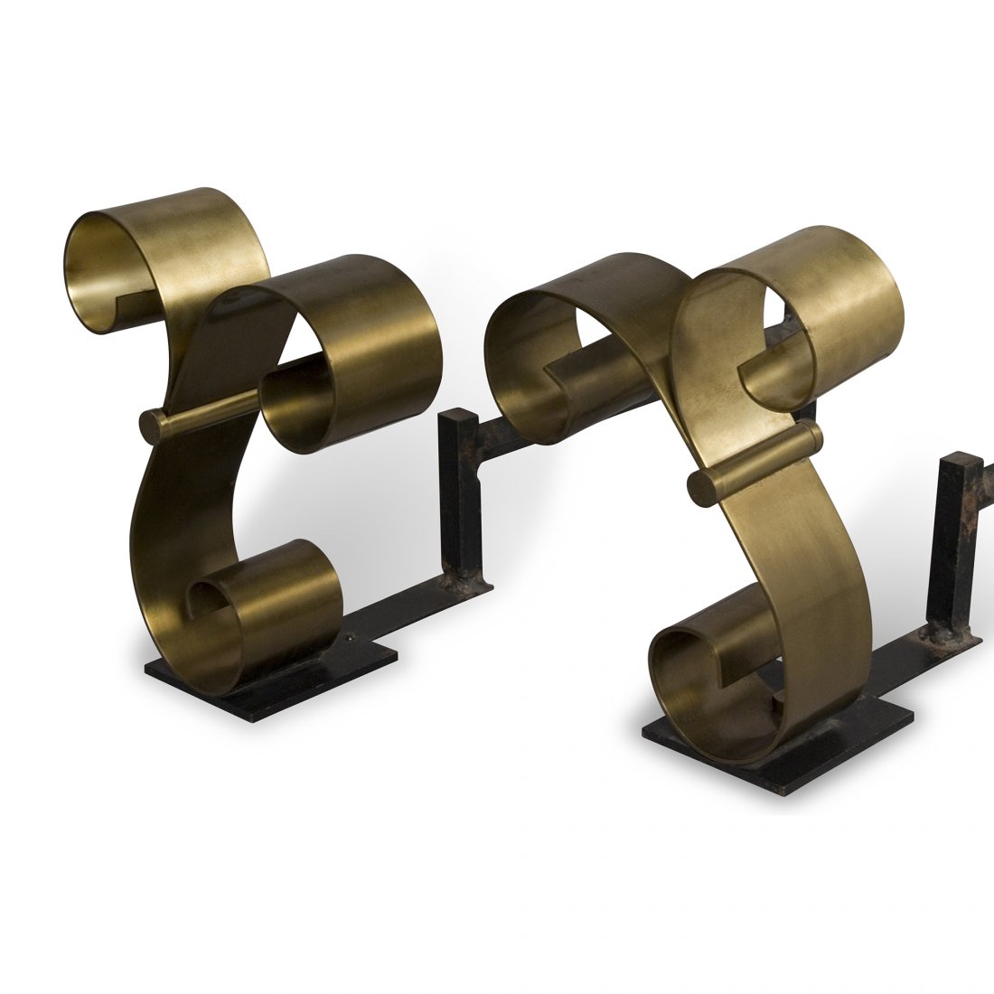 Scroll Andirons: Pair of polished bronze scroll form andirons, with cast iron log grates. American 1940s. Height 10.5 in, width 9.5 in, in depth of bronze scroll 3 in, overall depth 23 in.
