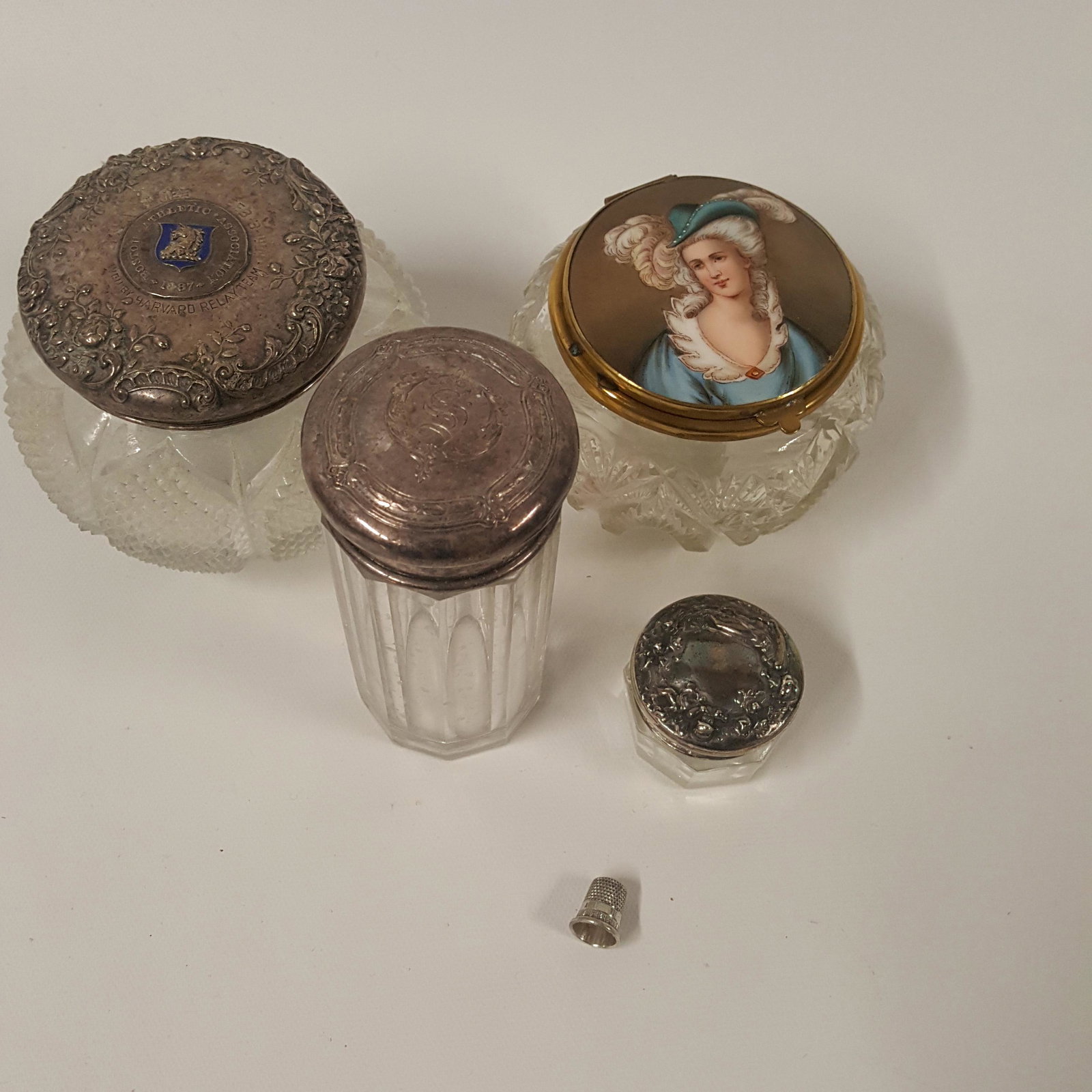 STERLING TOP DRESSER JARS with thimble and one with: STERLING TOP DRESSER JARS, one tall cylindrical, one small and one with BAA enamel cover and thimble