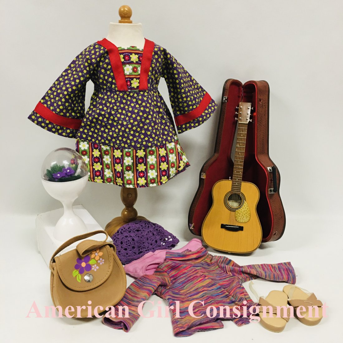 American Girl Doll Julie Calico Dress and Guitar: American Girl Doll Julie Calico Dress, and her accessories and Guitar with case. The case does not have latches. ------------------ please review all pictures carefully because they are part of the de