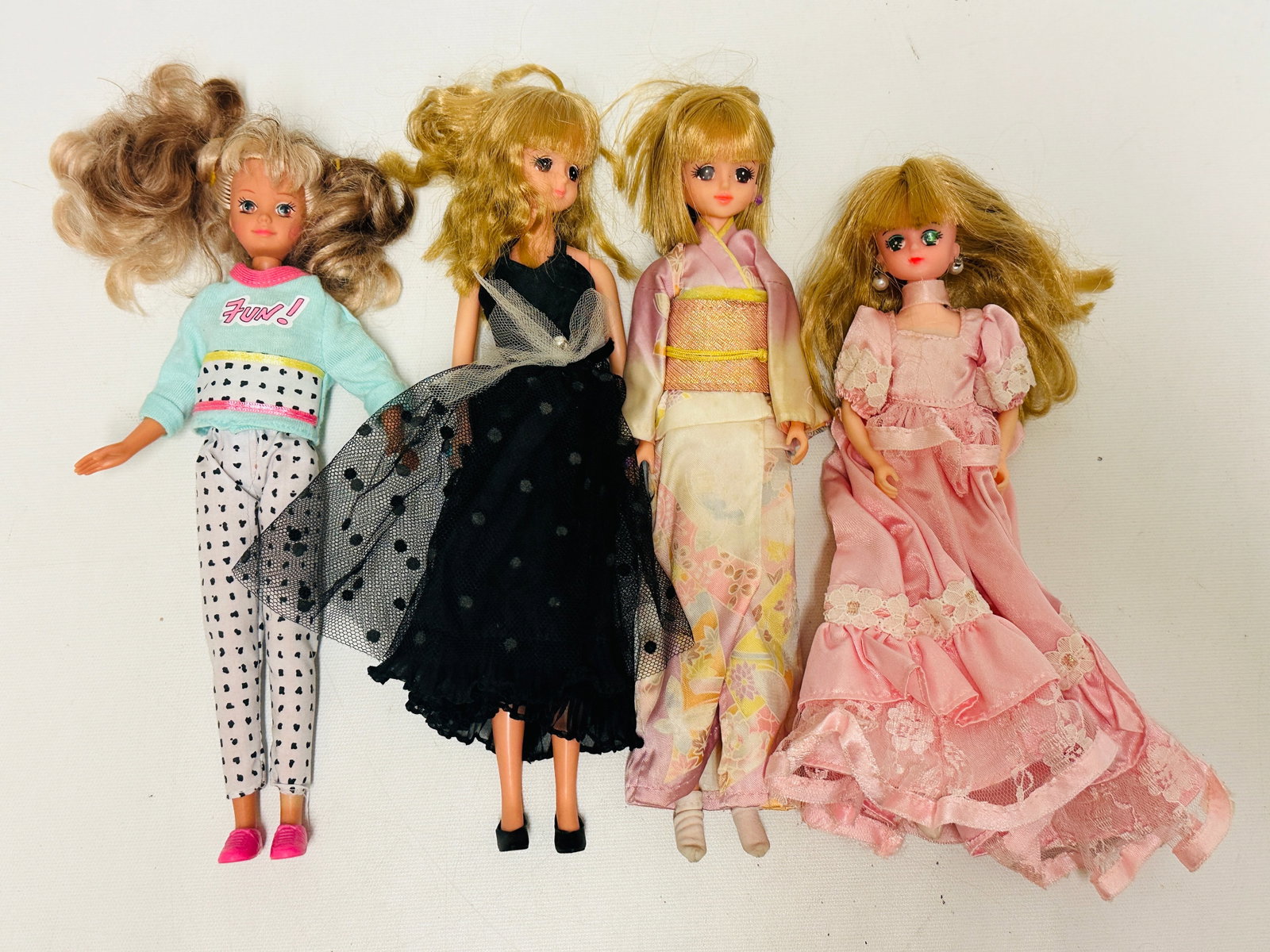 Group of Three Lottie Dolls and Barbie Skipper size Doll: Group of Three Lottie Dolls and Barbie Skipper size Doll ------------------ please review all pictures carefully because they are part of the description and show condition issues if any -------------