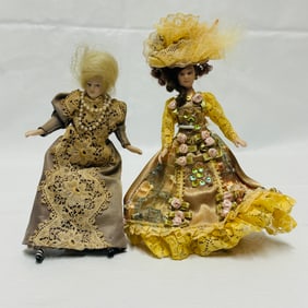 Two Ornately Dress porcelain Dollhouse Dolls