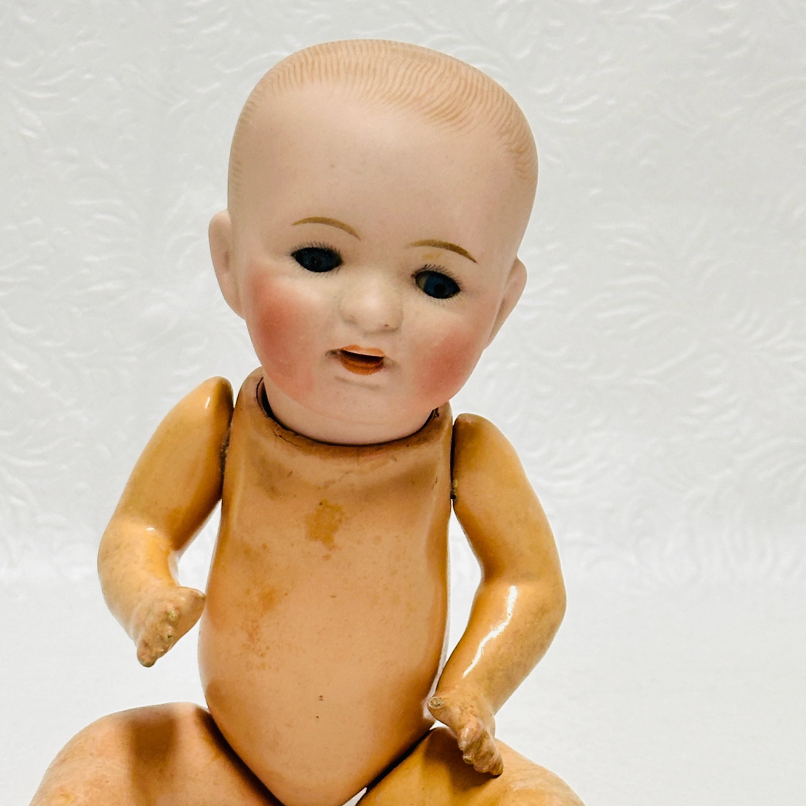 Antique Bisque Head Doll with Composition Baby Body: Antique Bisque Head Doll with Composition Baby Body, Dome head with painted hair, dark blue sleep eyes, open mouth with tongue but no teeth, compo baby body with original finish. Marking with number a