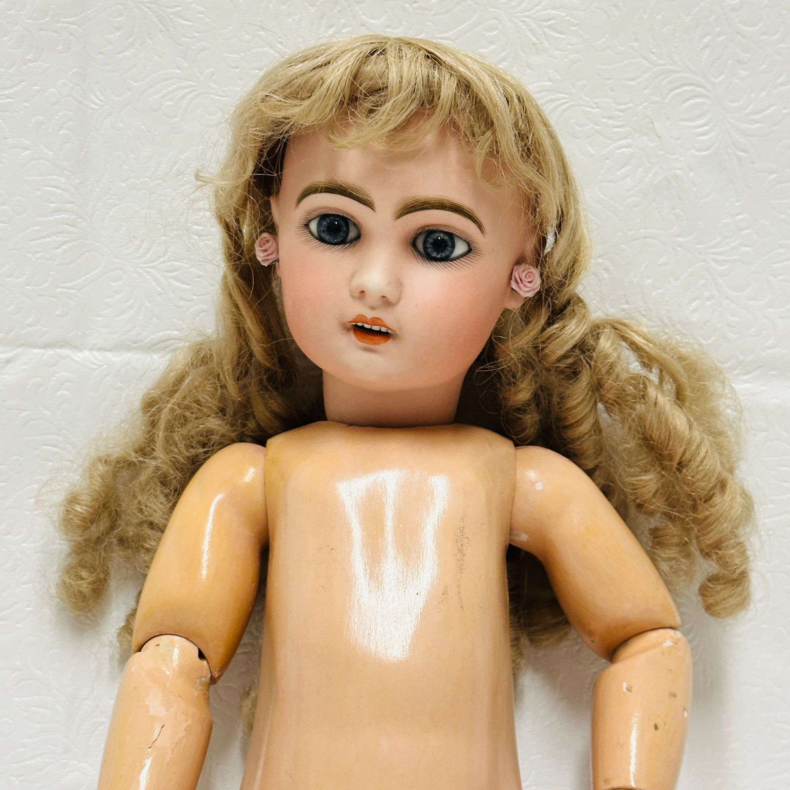 Open mouth Tete Jumeau Doll with labeled Body: Antique Tete Jumeau Doll with labeled jointed composition Body Open mouth Tete Jumeau marked only with size (could have been for a particular store) with dark blue fixed paperweight eyes, earrings, no