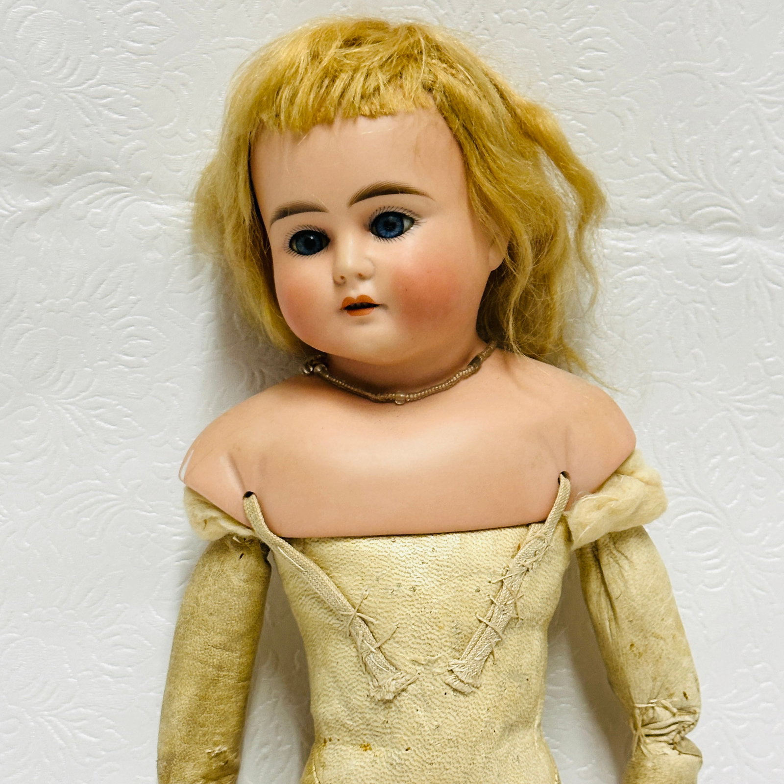 German Bisque Socket Head Shoulder plate Doll, Likely ABG: Antique German Bisque Socket Head Shoulder plate Doll, Likely ABG, shoulderhead doll with fixed neck, blue fixed eyes and open mouth with four teeth, original mohair blonde wig. Kid body with bisque l