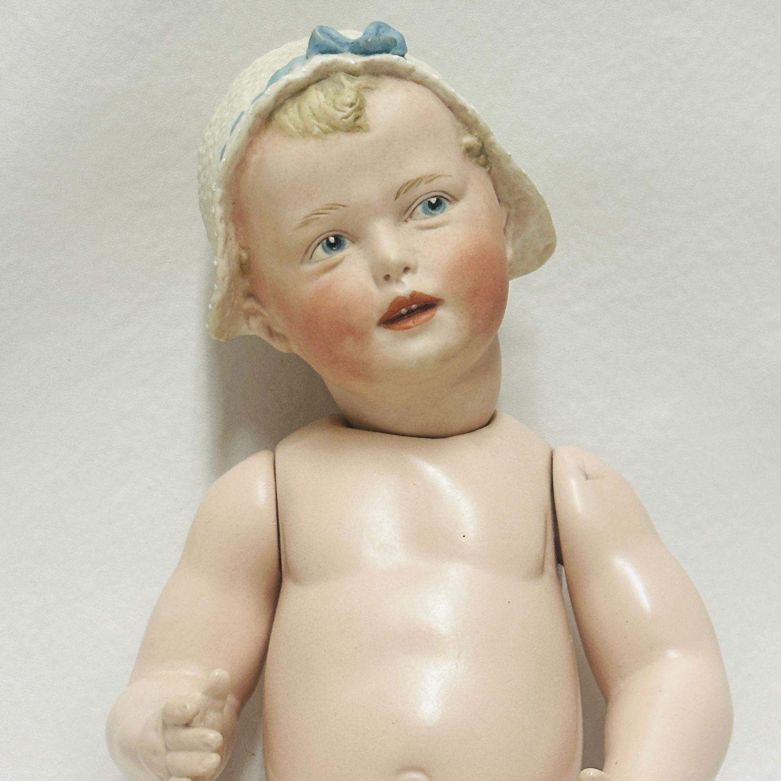 Molded on Bonnet Gebruder Heubach Doll with Baby Body (1 of 9)