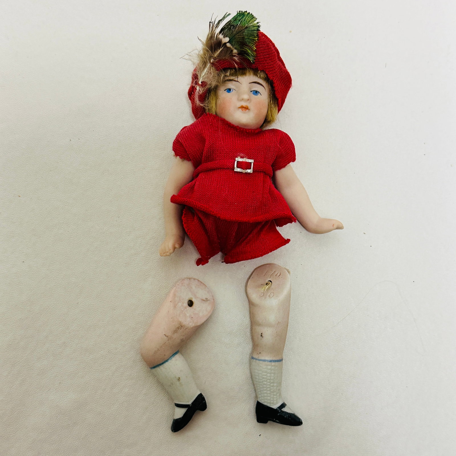 All Bisque Doll: Painted eyes, original wig, replaced costume, peg jointed body with painted socks and unusual bent leg on one side, All Bisque Doll with a pair of detached legs ------------------ please review all pi