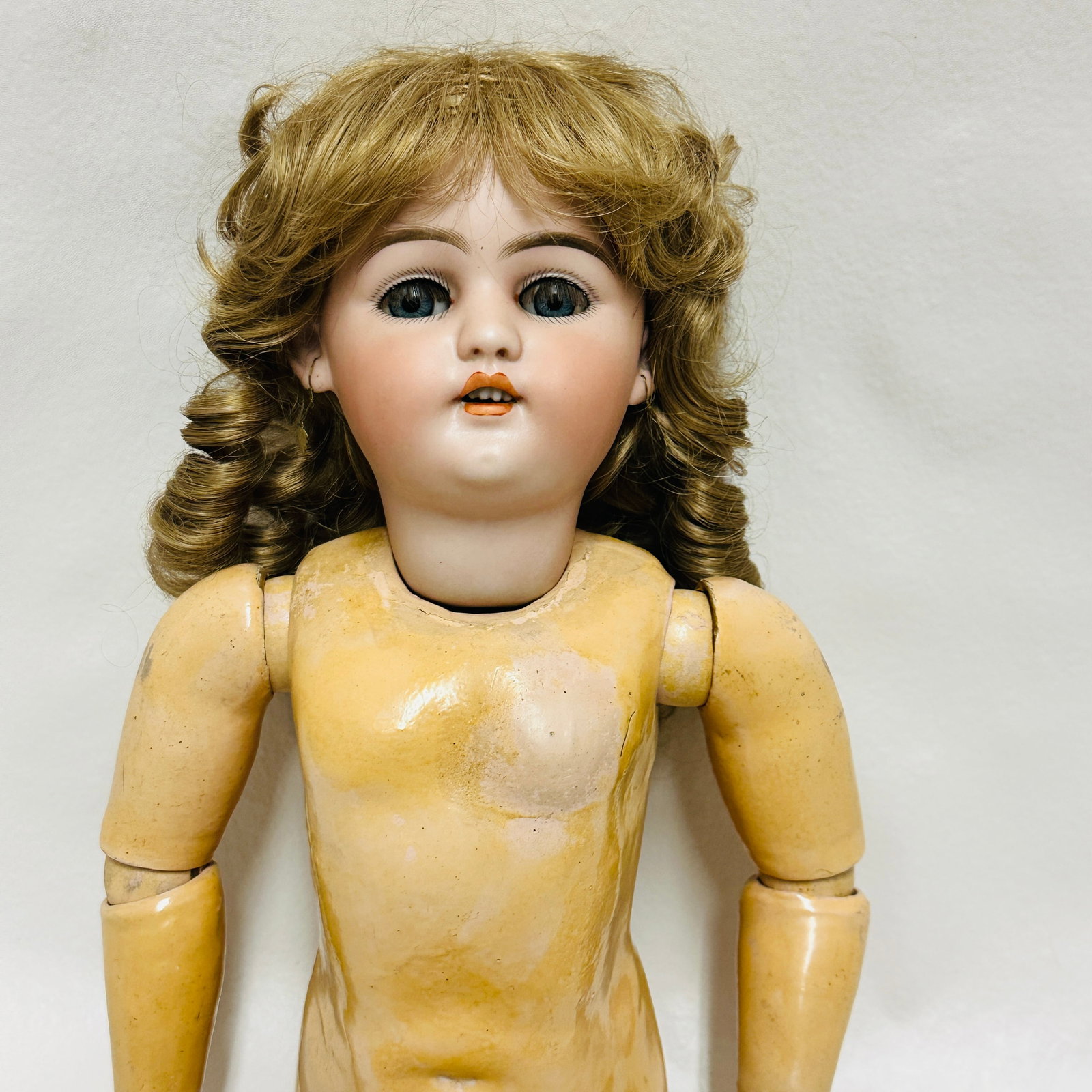 Antique German Simon Halbig 1019 DEP Bisque head Doll: Dark blue sleep eyes, open mouth with four teeth, nice bisque, replaced wig, earrings, wood and composition body with some loss of original body finish, Antique German Simon Halbig 1019 DEP Bisque hea