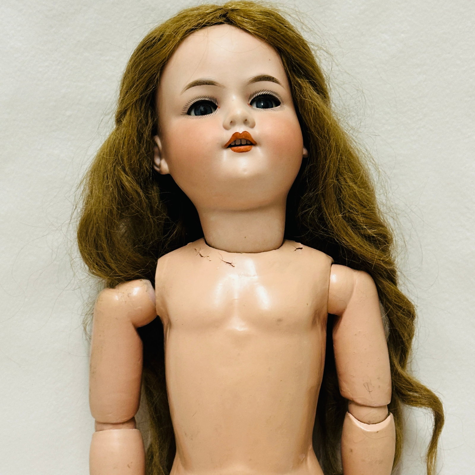 Antique German Armand Marseille 390 Doll: Dark blue sleep eyes, bright red lips on open mouth with four teeth, lush original human hair wig with original plaster pate, on wood and compo body with original finish, Antique German Armand Marseil