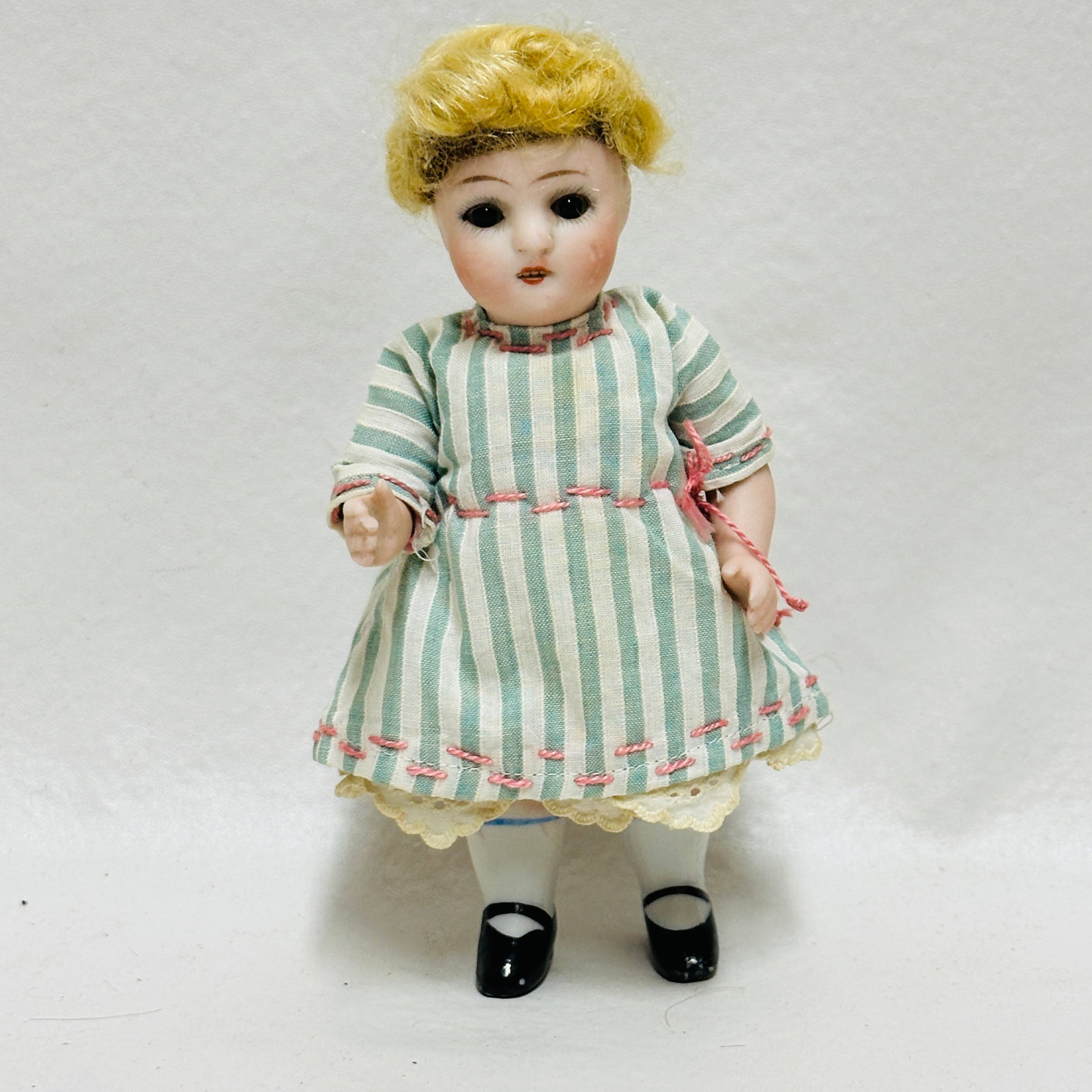 All Bisque Doll incised mark: Marked at the back of head, incised, Dark brown sleep eyes, open mouth with teeth, single stroke eyebrows, painted socks and shoes, original blonde mohair wig, mommy made costume, All Bisque Doll ----