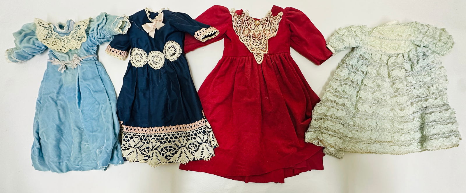 Group of four elegant Vintage Doll Dresses (1 of 7)