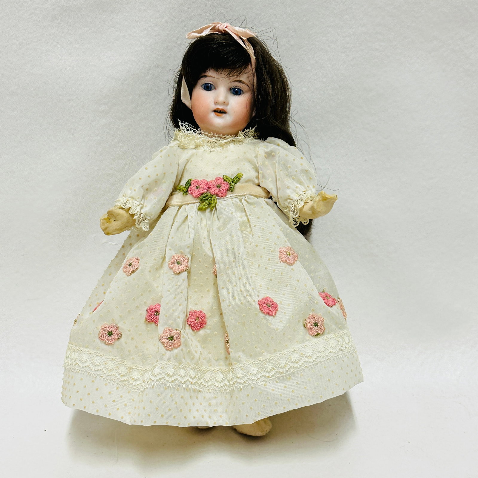 Antique Bisque Head Doll marked 390 in floral dress: Marked 390, Dark blue sleep eyes, open mouth with teeth, dark brown original wig on compo body with bare feet, vintage costume, Antique Bisque Head Doll in floral dress ------------------ please revie