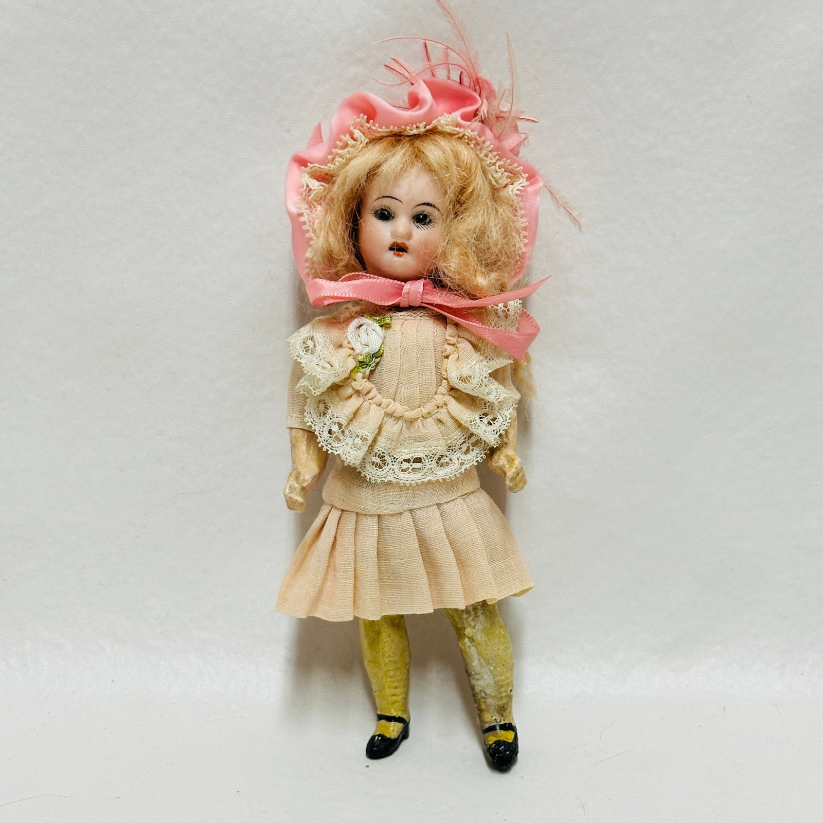 Antique Bisque Head Doll with Composition Body: Dark brown sleep eyes, open mouth with teeth, original mohair wig, on compo flapper body with painted shoes -one leg damaged, vintage costume and hat, Antique Bisque Head Doll with Composition Body --
