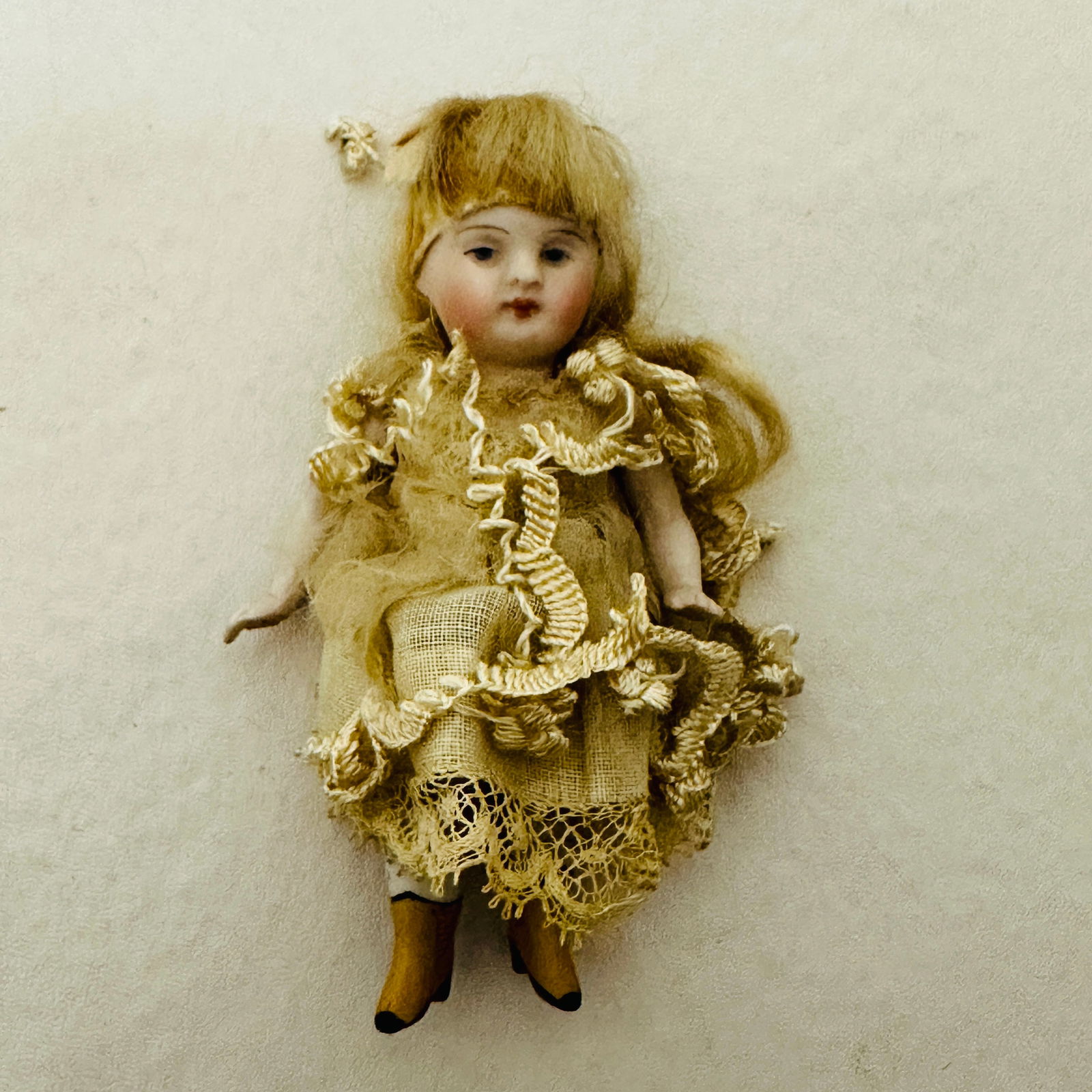 Antique All Bisque Doll: Blue painted eyes, pursed mouth, original mohair wig sparse, original costume, painted shoes and socks, outfit shredding, All Bisque Doll ------------------ please review all pictures carefully becaus