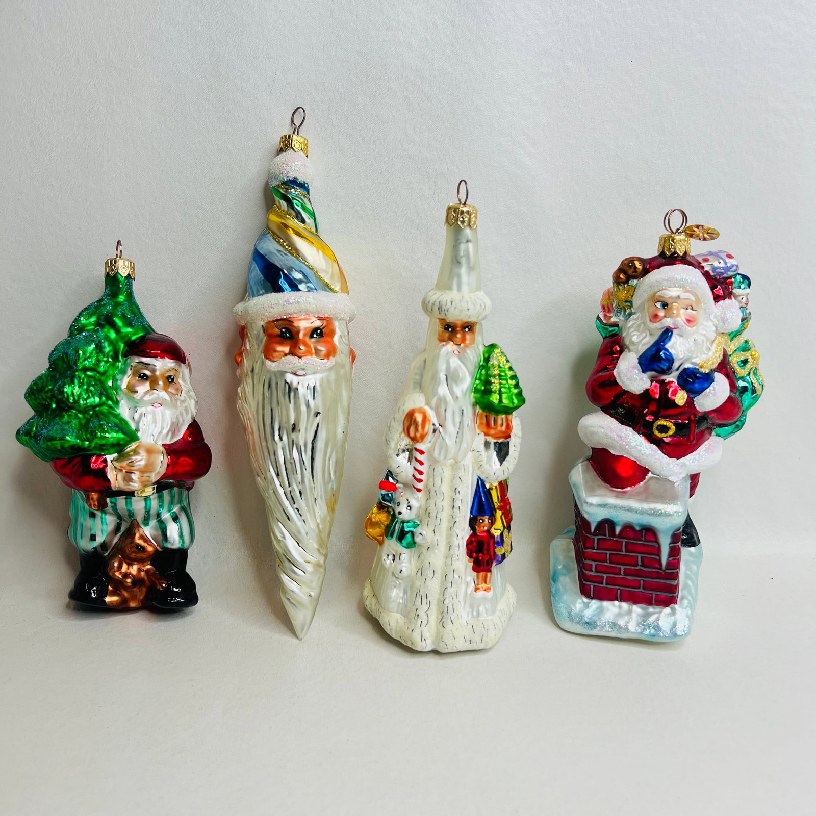 Four Christopher Radko Santa Ornaments: Four Christopher Radko Santa Ornaments, Elfin Pine, Enchanter, Slim Traveler, Secret Santa