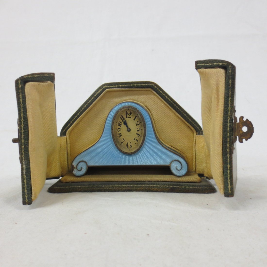 French blue Enamel and Silver Mantel Clock, marked: French blue Enamel and Silver Mantel Clock, marked Argent Dore 8 Day, in original fitted case, Marked with owner's name "Lilian Louise Greene 1925", 3.5x1x2.25, Includes Case