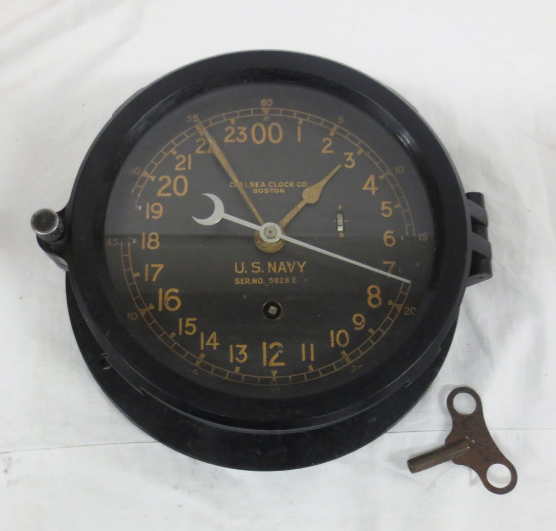 Chelsea Ship's Clock, 24 Hour Dial, with key: Chelsea Ship's Clock, 24 Hour Dial with second hand, Non-magnetic case "Chelsea Clock Co., Boston". U. S. Navy with hinged door, Minor wear, overall diameter is approx. 7.5" and clock face at approx.