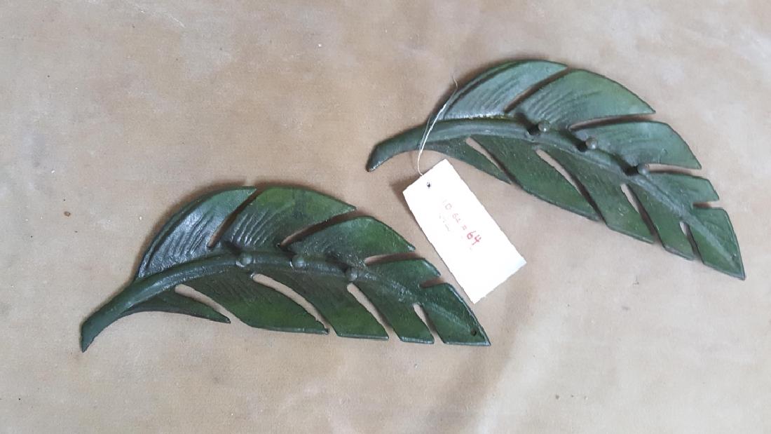 A Pair of Cast Iron Big Leaf Coat Hangers: A matching pair of painted iron leaves, each with three posts. Coat hangers, keys, etc.... 15.5"