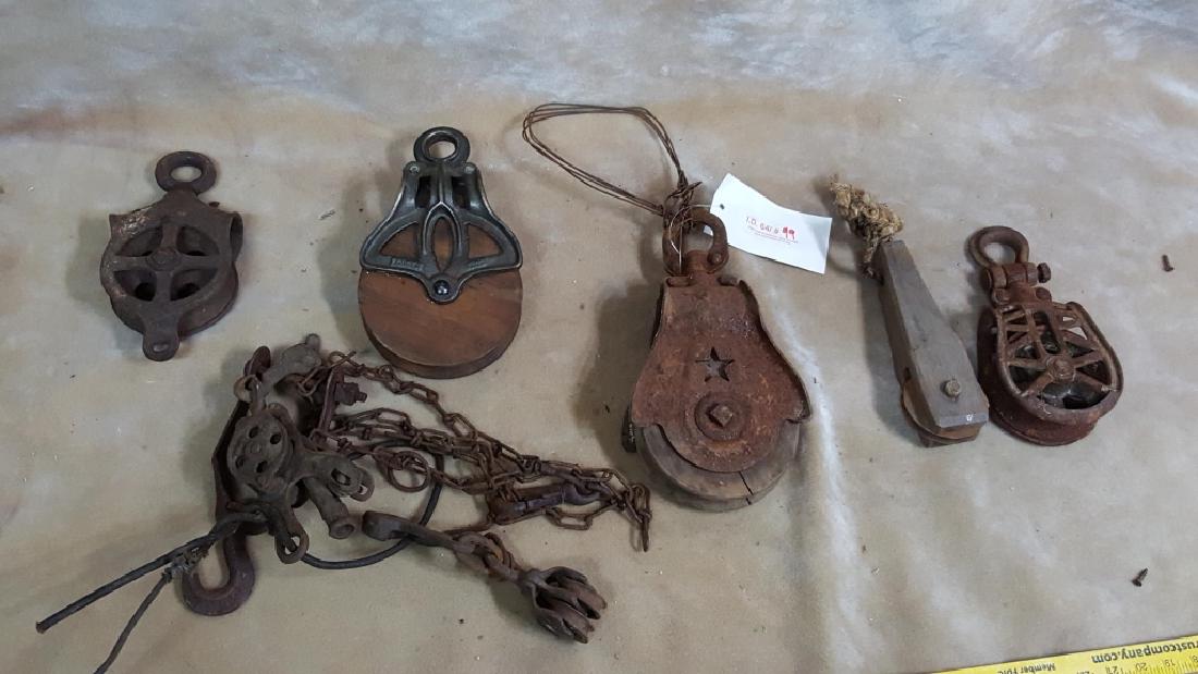 Collection of Antique Pulleys; Starline and more: Both wood and cast iron pulleys, including several Starline pulleys.