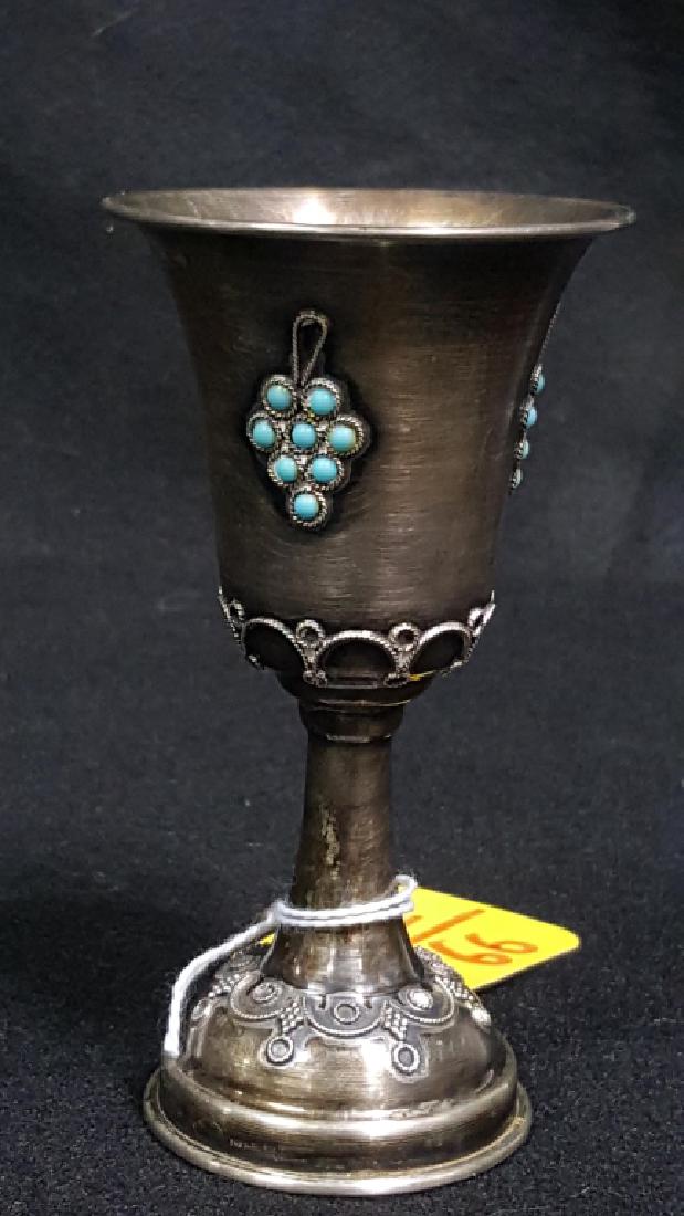 Sterling Silver Kiddush Cup with Mounted Gemstones: Marked Israel 925 and a makers mark. With embossed rope and grapes surrounding the base. Mounted blue gemstones also with embossed sterling rope. 4.5"